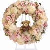Baby girl funeral wreath spray with pink hydrangeas cream roses pale pink spray roses chrysanthemums waxflower teddy bear and easel stand