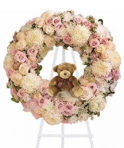 Baby girl funeral wreath spray with pink hydrangeas cream roses pale pink spray roses chrysanthemums waxflower teddy bear and easel stand