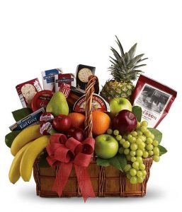 Bon Vivant gourmet sympathy gift basket filled with comforting fruit, cheese, crackers, cookies, tea, and sweet treats, arranged as a thoughtful condolence gift for a grieving family.