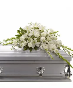 Bountiful Memories Casket Spray with white lilies gladioli carnations and greenery