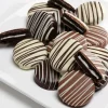 One dozen chocolate covered OREO Cookies gift dipped in milk, white, and dark chocolate with decorative chocolate drizzle