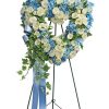 Close To My Heart heart shaped standing spray with blue hydrangea and white roses