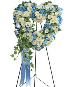 Close To My Heart heart shaped standing spray with blue hydrangea and white roses