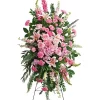 Pink standing spray with hydrangea roses lilies carnations larkspur stock and snapdragons