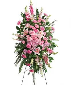 Pink standing spray with hydrangea roses lilies carnations larkspur stock and snapdragons