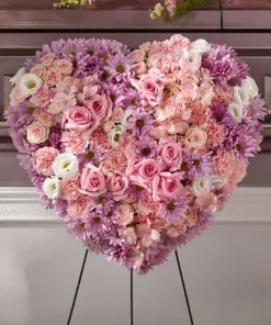Heaven's Light Heart Spray with pink roses carnations alstroemeria white lisianthus lavender daisy poms and pink spray roses