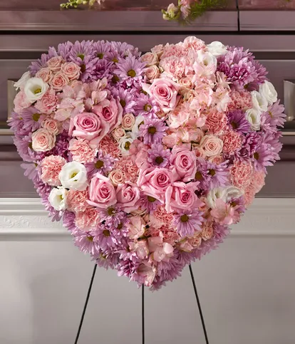 Heaven's Light Heart Spray with pink roses carnations alstroemeria white lisianthus lavender daisy poms and pink spray roses