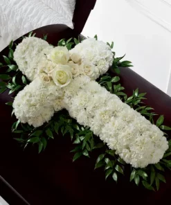 In Memoriam Casket Spray white cross funeral flowers with carnations and roses