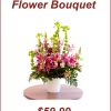 Large pink lily sympathy bouquet with snapdragons, alstroemeria, green gladiolus, and white container