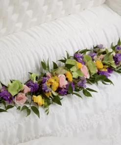Trail of Blooms Casket Adornment with hydrangea roses freesia larkspur and button poms