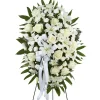 White funeral standing spray with lilies roses carnations and chrysanthemums